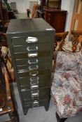 A set of filing drawers, in military green