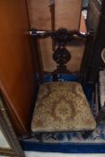A Victorian mahogany salon/nursing chair having overstuffed seat