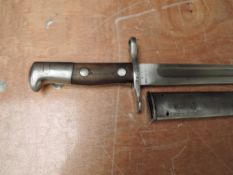 A Swiss model 1899 Bayonet, stamped Maschinenfabrik, Bern, no 77208, with metal scabbard, blade