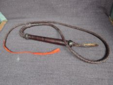 A vintage Horse Carriage Whip, leather grip handle, length 25cm, overall length 170cm