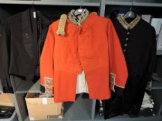 A black Mess Jacket with The Kings Lapel Badge, Pips, Crown and T on shoulder with Hawkes & Co