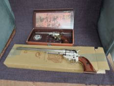 A Denix Replica Peacemaker Revolver with 10' barrel in box and a Kolser Replica Single Action 45