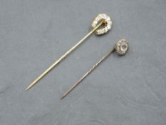 An 18ct gold horse shoe stick pin set with eleven old cut diamonds, total approx 0.45ct & 4g, and