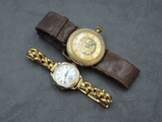 A 14k gold cased wristwatch, with Roman hours to the engraved dial, engraved case back marked 14k,