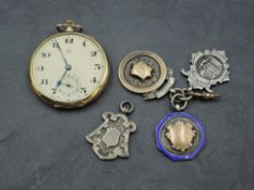 Four HM silver medallions including two with enamel and yellow metal decoration and a rolled gold