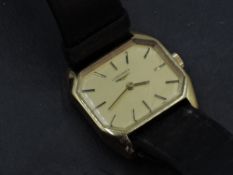 A Longines gilt metal wristwatch, of canted rectangular form with baton hour markers, original