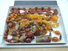 A selection of mixed amber, Baltic amber and amber style necklaces etc