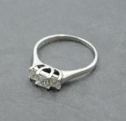 A princess cut diamond trio dress ring, total approx 0.65ct in a claw set stepped looped mount on an