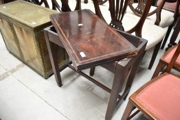 An early 20th Century mahogany and inlaid fold over tea table of small proportions, closed width