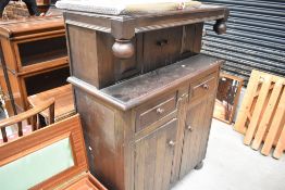 A mid 20th Century oak court cupboard of small proportions, width approx. 91cm