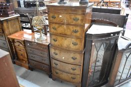 A reproduction mahogany and walnut chest on chest of narrow proportions, height approx 131cm