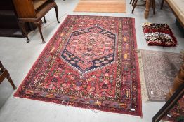 A Persian rug, approx. 205 x 130cm