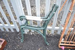 A pair of cast iron and wooden handle bench ends
