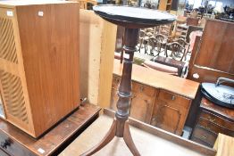 A 19th Century mahogany candlestand having circular top, turned column and triple splay legs