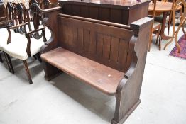 A traditional dark stained pine pew, of lovely proportions, width approx. 124cm