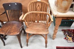 A traditional ash and elm Windsor chair having crinoline stretcher