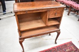 An early 20th Century walnut side cabinet