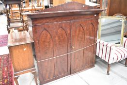 A Victorian mahogany bookcase top having gothic style panelled doors width approx. 134cm