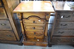A small modern stained frame chest of drawers