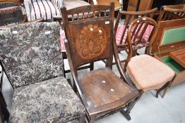 A 19th Century rocking chair with ply seat and stylised back