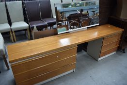 A vintage teak and laminate dressing table