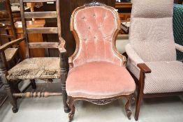 A Victorian easy chair having mahogany knurl frame and dralon upholstery