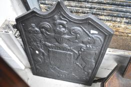 A cast iron fireback