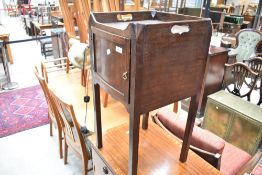 A 19th Century mahogany pot cupboard/night stand on square legs