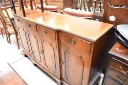 A reproduction Regency style breakfront sideboard