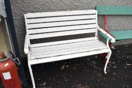 A modern garden bench with cast iron ends