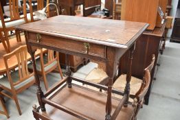 A 19th Century oak side table having frieze drawer and turned frame