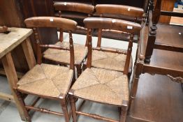A set of four 19th Century rush seated dining chairs