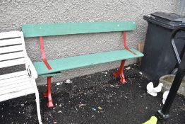 A railway style bench having painted cast legs and supports (af)