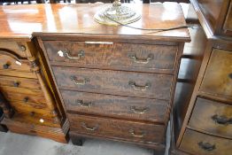 A reproduction chest of drawers, of small proportions, width approx. 52cm