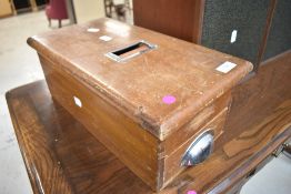 A vintage wooden cash till