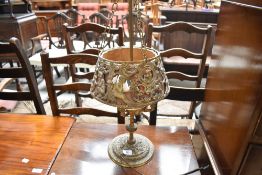 A vintage brass table lamp of ornate design