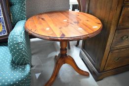 A modern pine pedestal side table