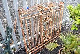 A pair of wrought iron drive way gates