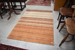 A modern rug in orange and brown design, approx. 168 x 112cm
