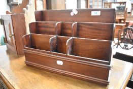 A reproduction mahogany stationery rack