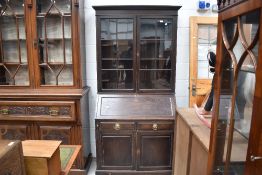 An early 20th Century oak bureau bookcase