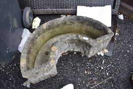 a modern composite concrete half circle trough