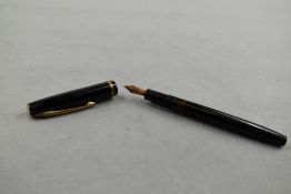 A Soennecken 101L piston fill fountain pen in black with single band to the cap having Soennecken