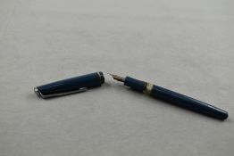 An Osmiroid 75 piston fill fountain pen in blue with single band to the cap with Rolitip Medium Soft