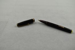 A Mentmore Diploma leverfill fountain pen in black with a broad band to the cap. Approx 13.1cm