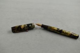 A Waterman leverfill fountain pen in green/black marble with single band to cap having Waterman