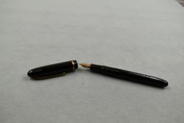 A Waterman Champion 501 leverfill fountain pen in black with single band to the cap having