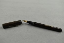 A Waterman Ideal leverfill fountain pen in black with chaised design having Waterman Ideal nib.