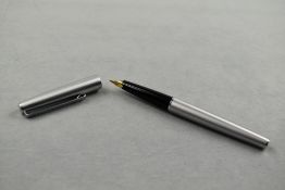A Conway Stewart cartridge fountain pen in brushed steel