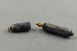 An Osmiroid leverfill fountain pen in blue/purple/grey marble with ring cap having Osmiroid nib.